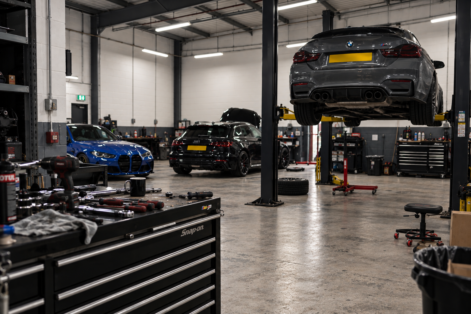 Motovanta Automotive workshop with vehicle lifts and technicians